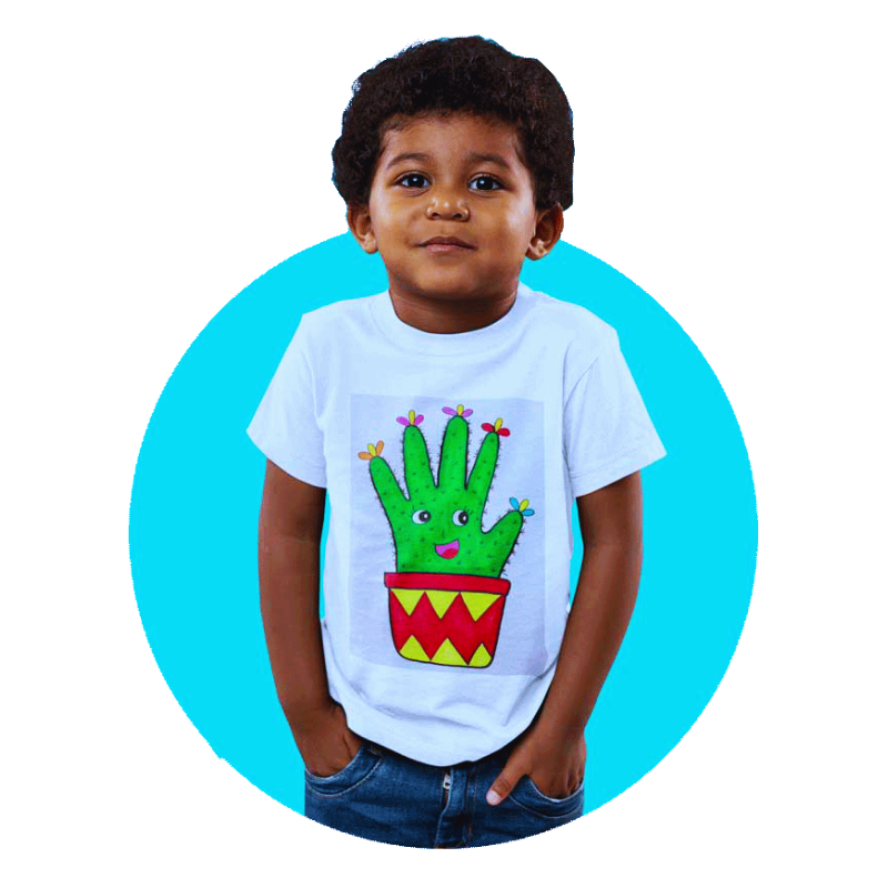 A young boy wearing a white t-shirt featuring a colorful cactus design with a hand growing from a pot.